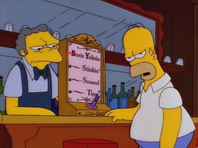 Гомер дует в трубочку и аппарат показывает крайний уровень опьянения, который обозначен как "Борис Ельцин".