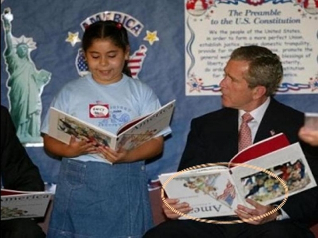 Буш и книга "вверх ногами".
